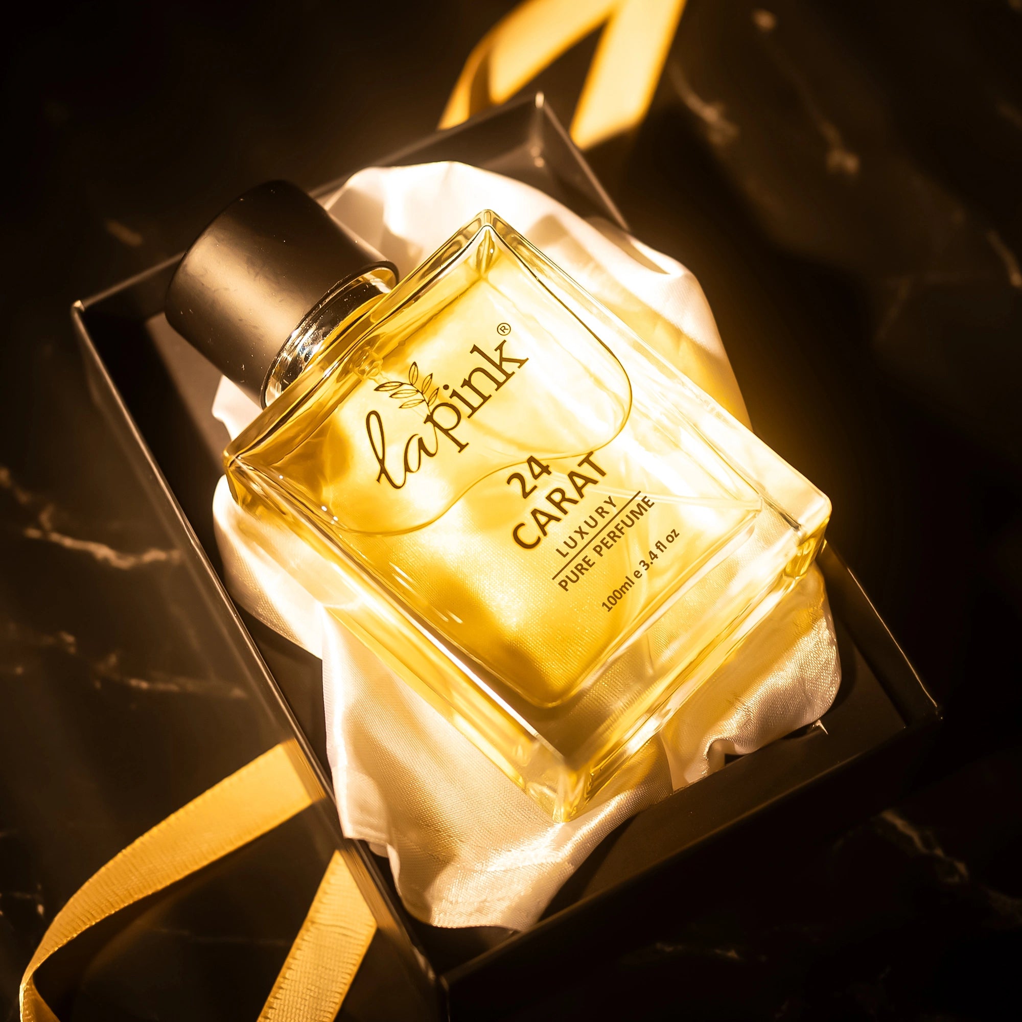 Lapink 24 Carat Luxury Pure Perfume bottle in a decorative box with a gold ribbon.