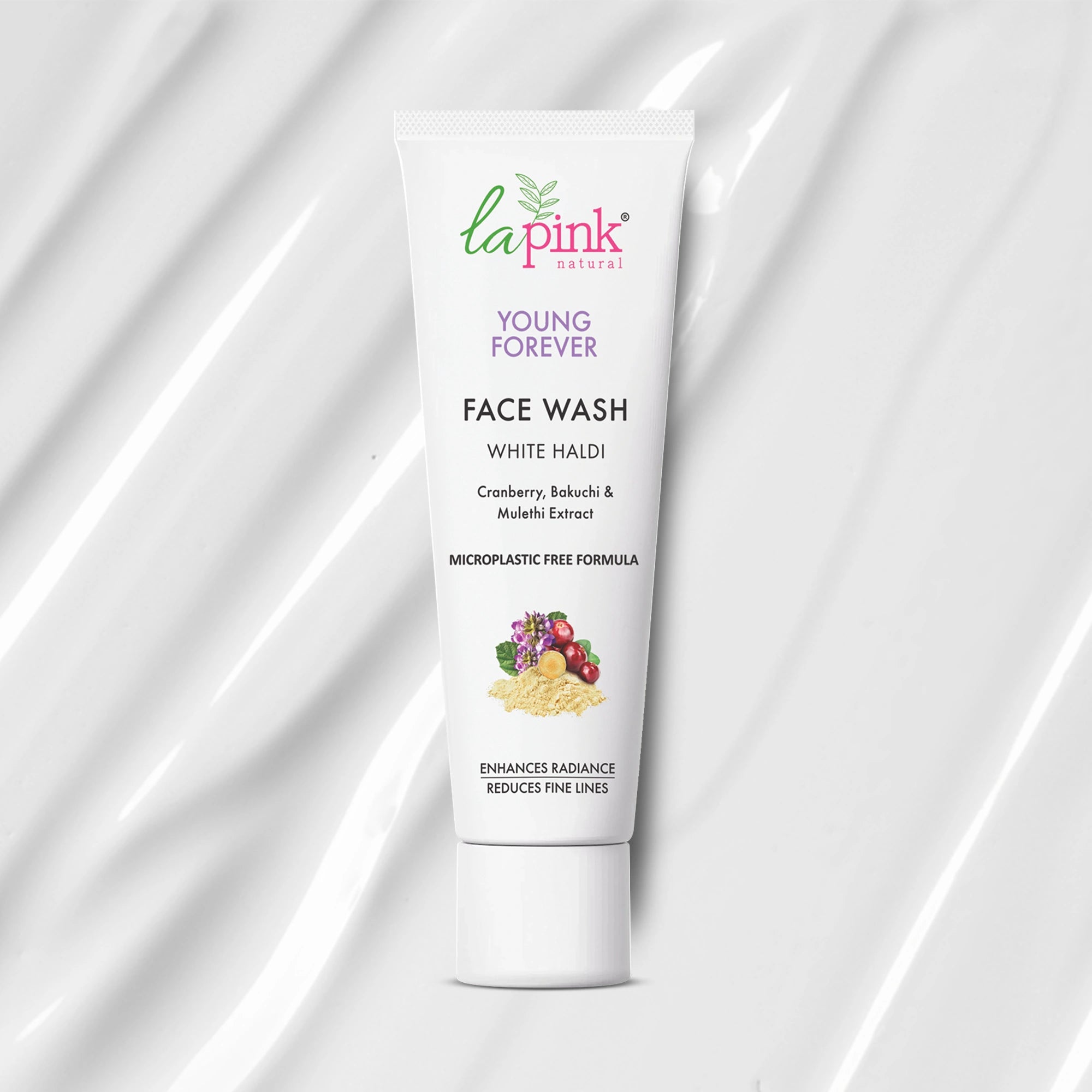 Tube of La Pink Young Forever Face Wash on a white fabric background