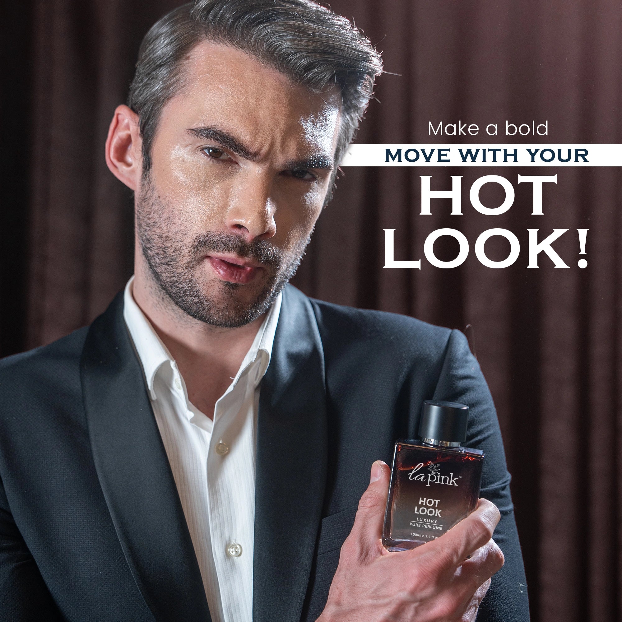Man holding a perfume bottle with text &