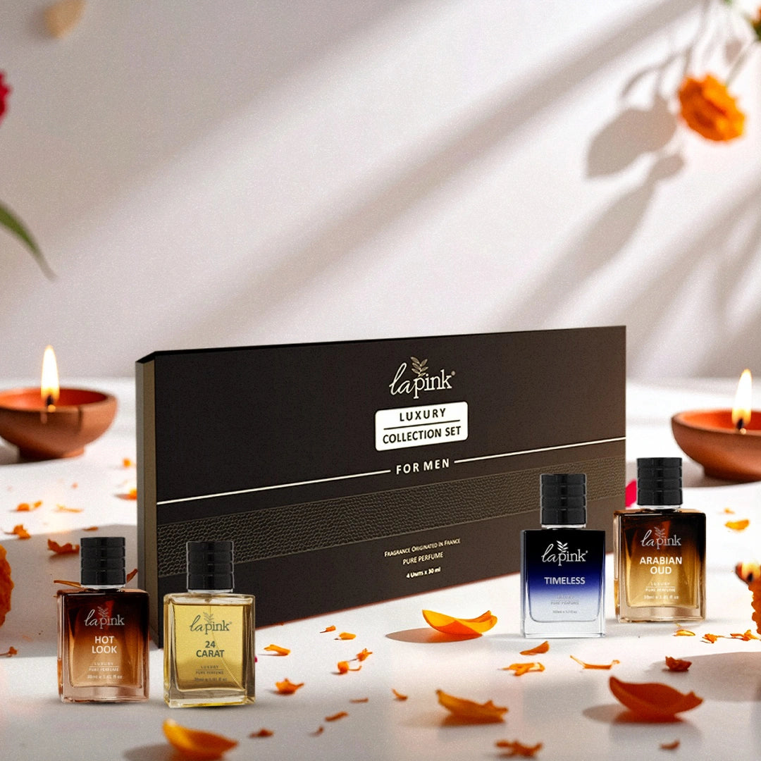 La Pink luxury perfume collection set for men on a decorative surface with candles and flowers.