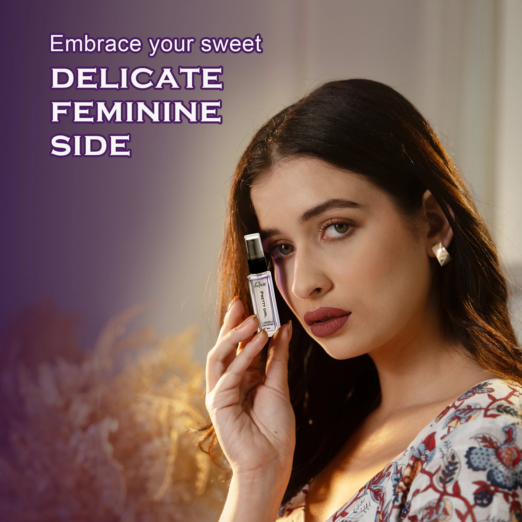 Woman holding a perfume bottle with text &