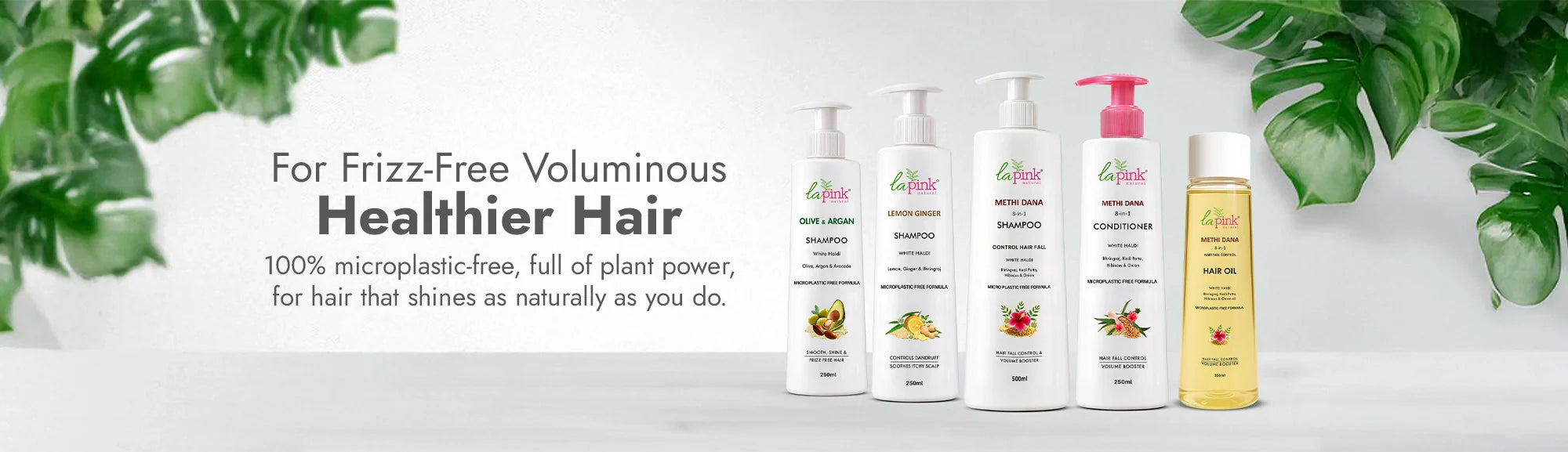 Set of hair care products with branding on a light gray background