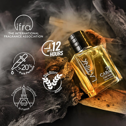 A bottle of Knirvyl 22 Cara pure fragrance oil with amber-colored liquid and a black cap, styled on dark wood with smoke effects. The image includes the &