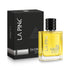 A bottle of LA PINK 24 Carat pure perfume with golden-yellow liquid, next to its black textured packaging box, on a white background.

