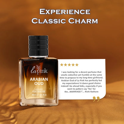La Pink Arabian Oud perfume bottle with a five-star review card on a warm brown background