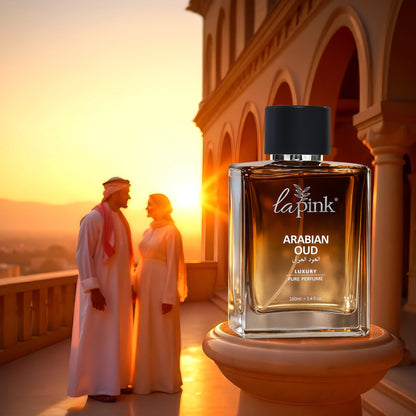 Lapink Arabian Oud perfume bottle with a couple in traditional attire against a sunset backdrop.