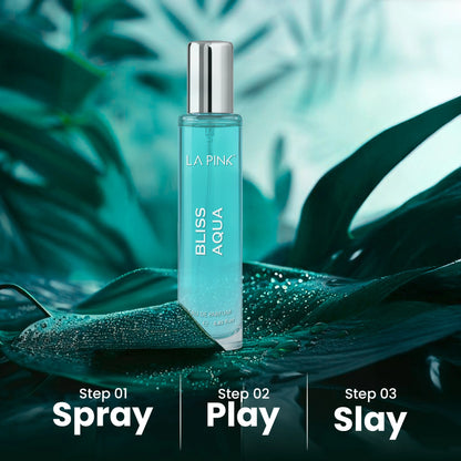 La Pink Bliss Aqua perfume bottle on a leaf with a green leafy background