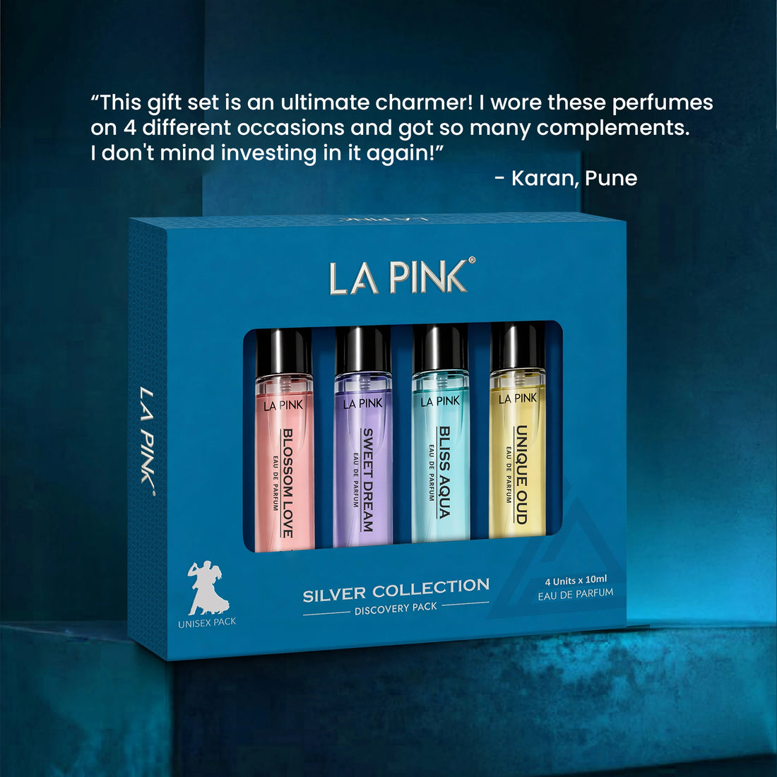 LA Pink perfume set with four bottles in a blue box on a dark blue background