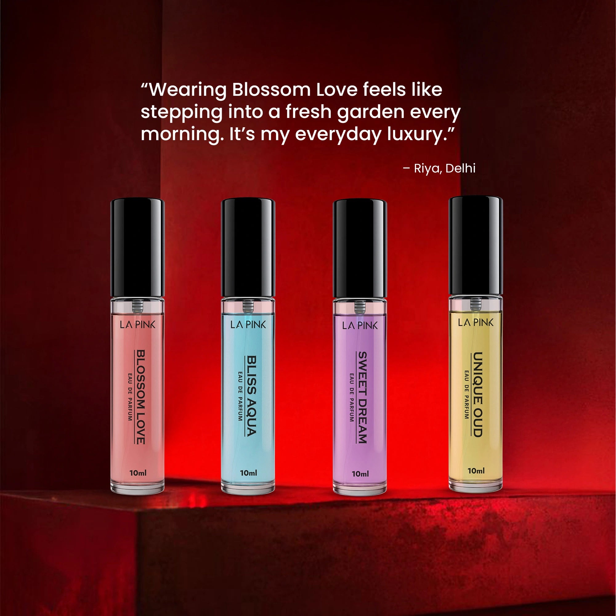 Four perfume bottles with different colored caps on a red background, featuring a quote about wearing &