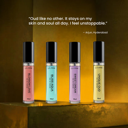 Four perfume bottles with different colored caps on a reflective surface, with a quote above them.