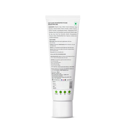 White tube of skincare product with text and green icons on a white background