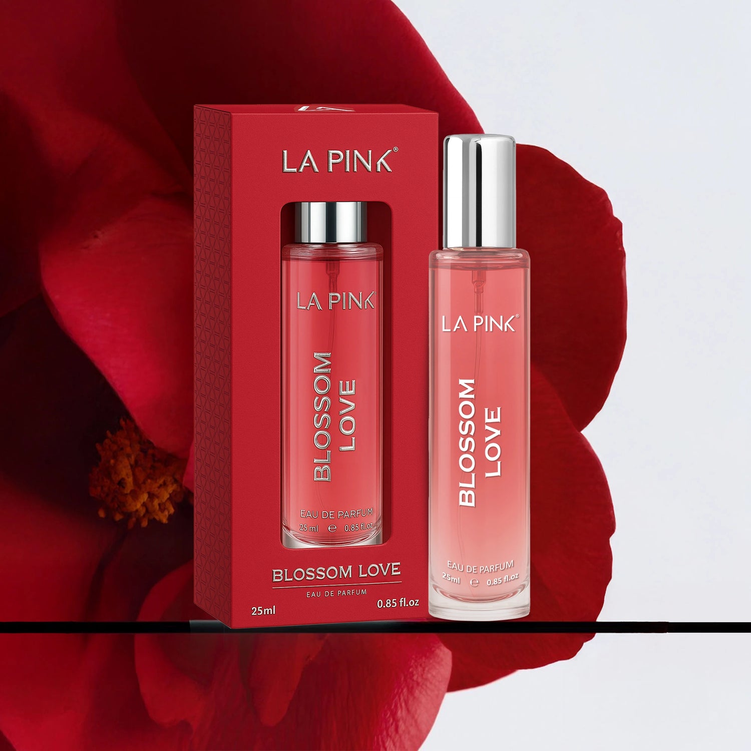 La Pink Blossom Love perfume set with red packaging and red flower background