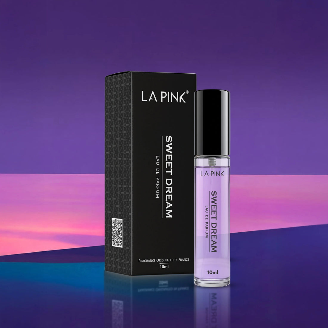LA PINK Sweet Dream perfume bottle and packaging on a reflective surface with a gradient purple background