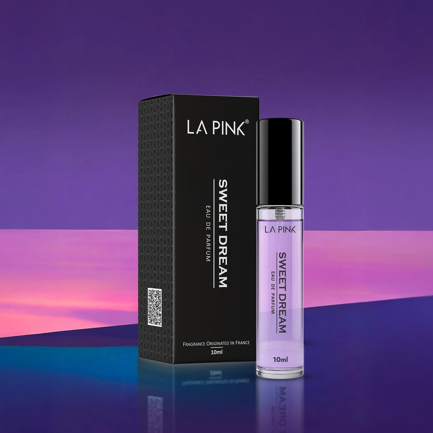 LA PINK Sweet Dream perfume bottle and packaging on a reflective surface with a gradient purple background