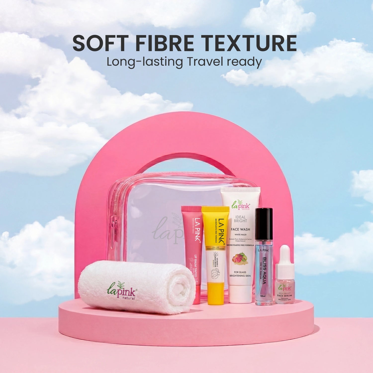 Pink travel pouch with skincare products against a cloudy sky background