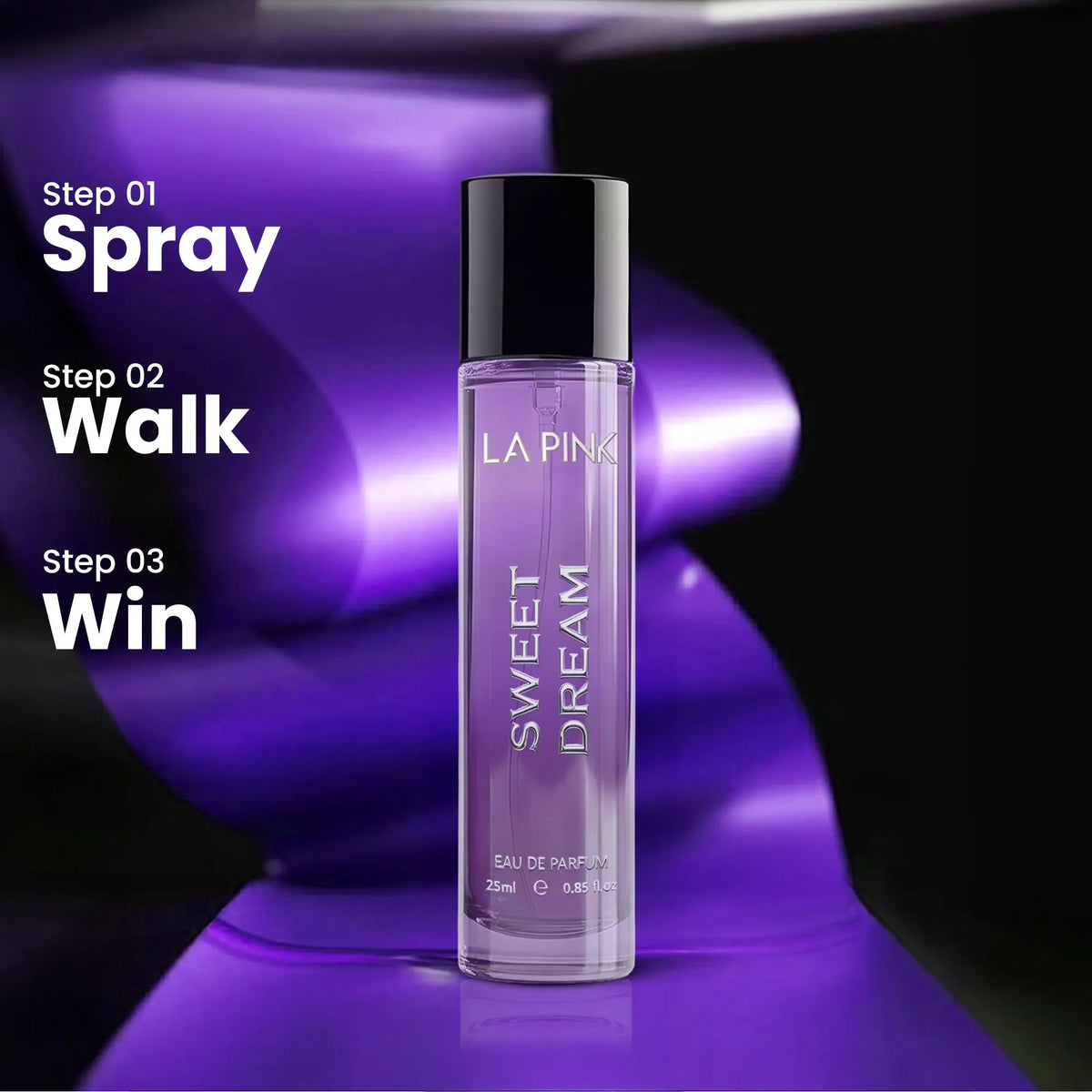 A clear cylindrical perfume bottle labeled LA PINK SWEET DREAM stands on a glossy purple surface against a dark background with purple lighting. 