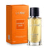A bottle of LA PINK Unique Oud Eau de Parfum with its orange packaging box, displayed on a clean white background.

