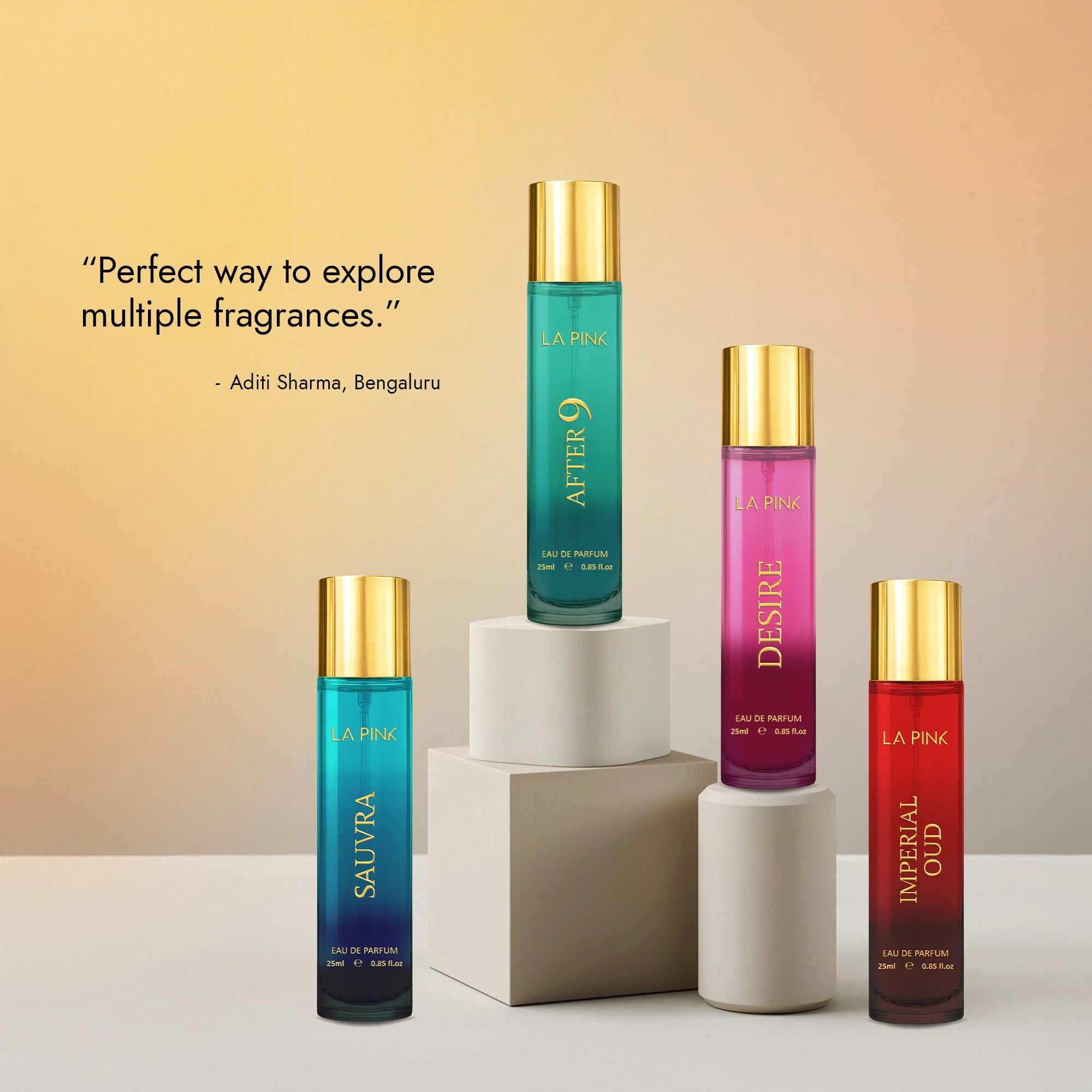 Four perfume bottles with gold caps on a gradient background