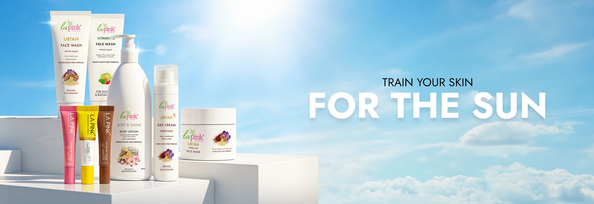 Sunscreen products with a clear blue sky background and text 'Train Your Skin For The Sun'.