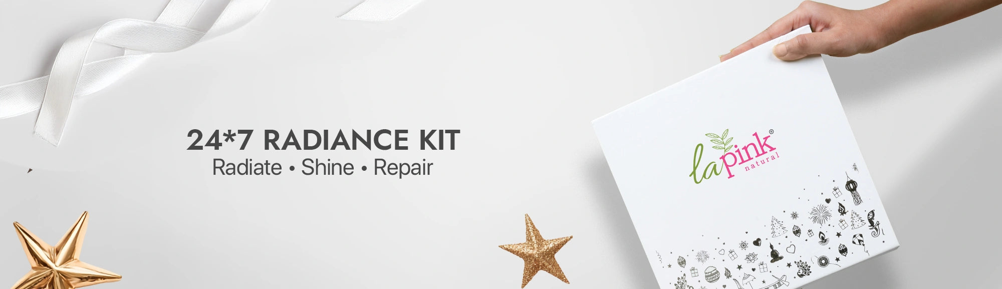 La Pink 24/7 Radiance Kit with decorative elements on a white background