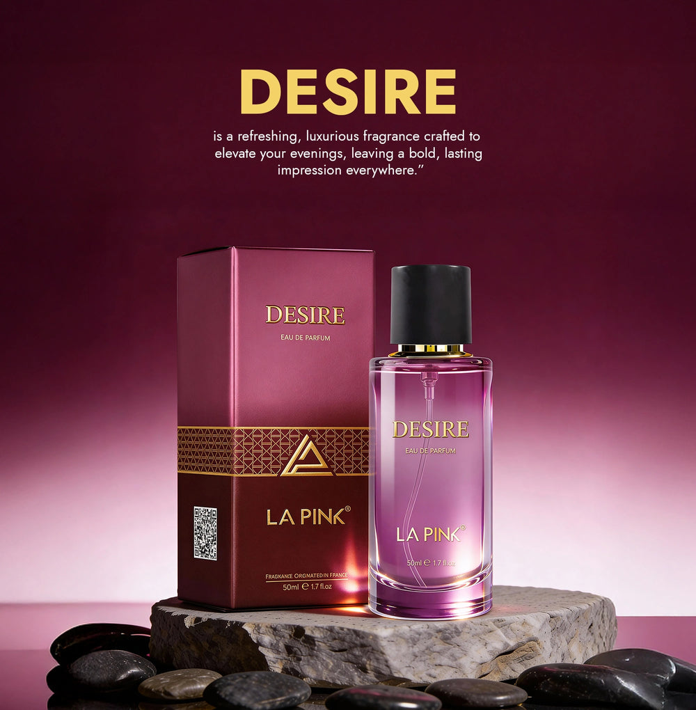 La Pink Desire perfume bottle and packaging on a stone surface with a pink gradient background