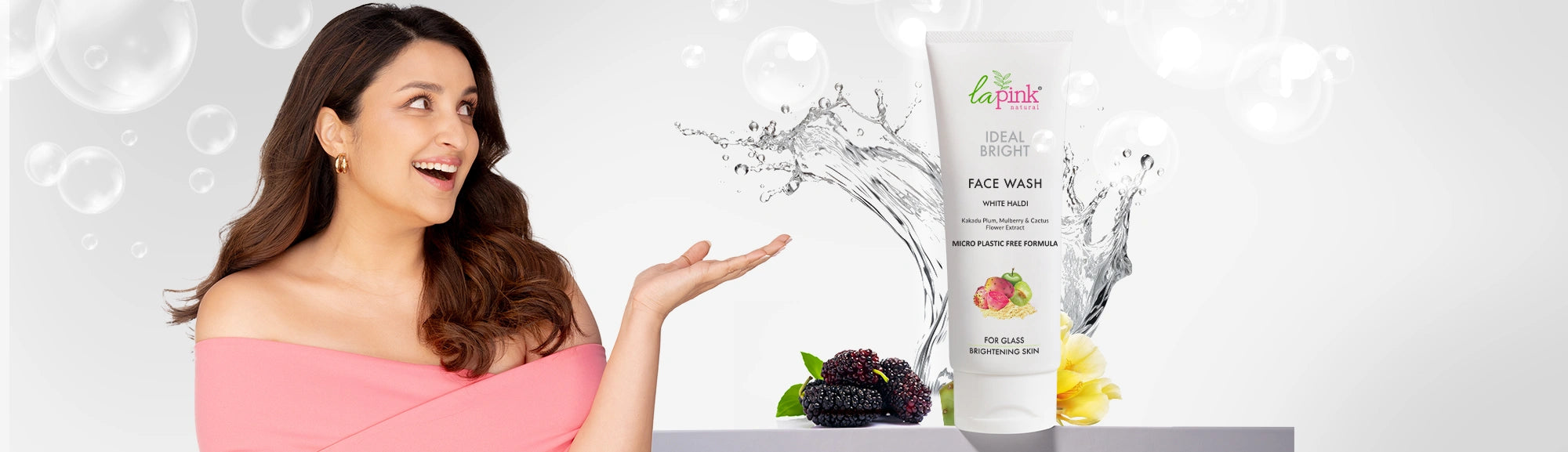 Woman holding a skincare product with a white background