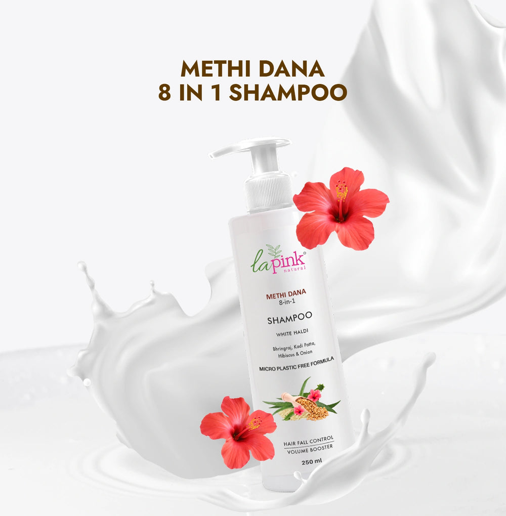 Methi Dana 8 in 1 shampoo bottle with hibiscus flowers on a white background