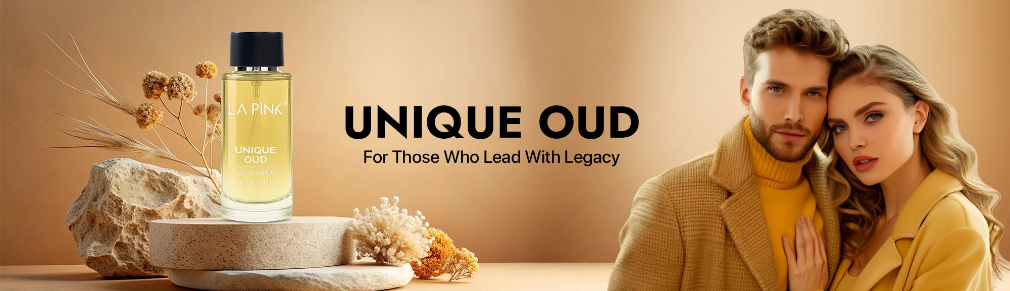 Two people in stylish outfits with a bottle of 'UNIQUE OUD' on a beige background