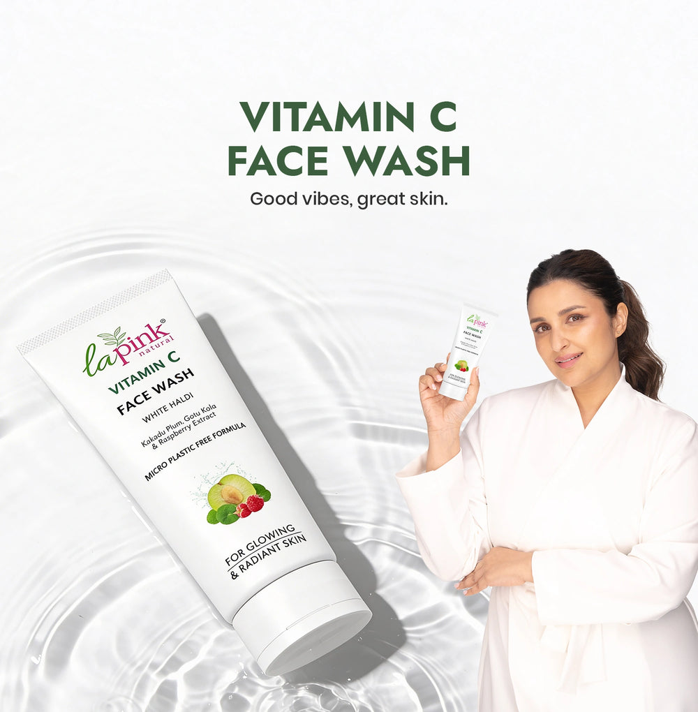 La Pink Vitamin C Face Wash with a woman holding the product on a white background