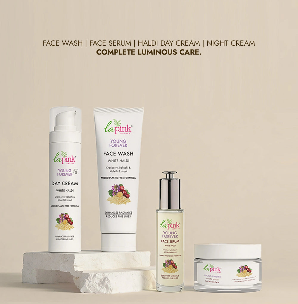 La Pink skincare products including face wash, day cream, serum, and night cream on a beige background.