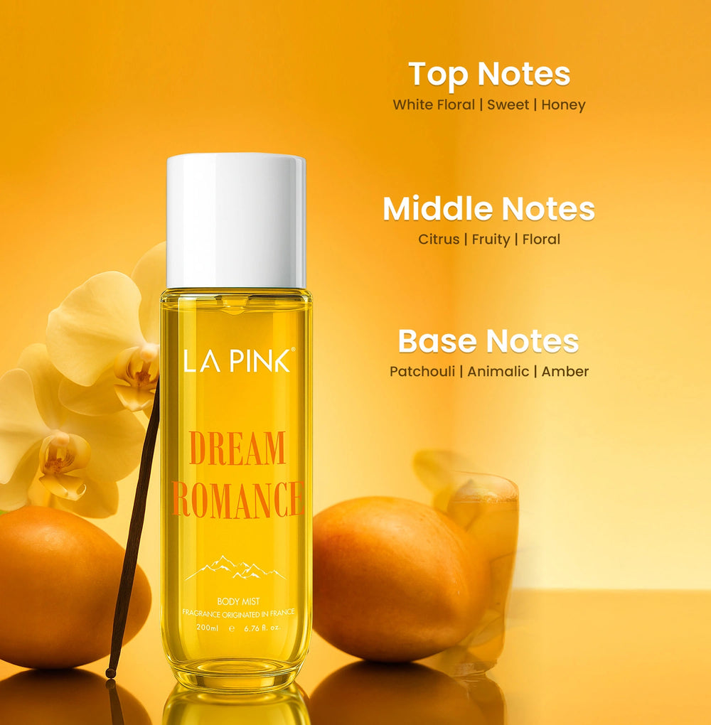 La Pink Dream Romance bottle with vanilla beans and orange on a yellow background