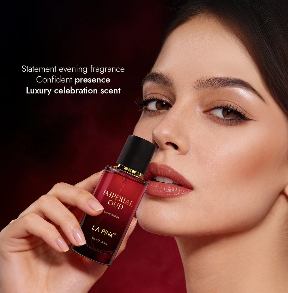 Woman holding a red perfume bottle labeled 'IMPERIAL OUD' by 'LA PINK'.