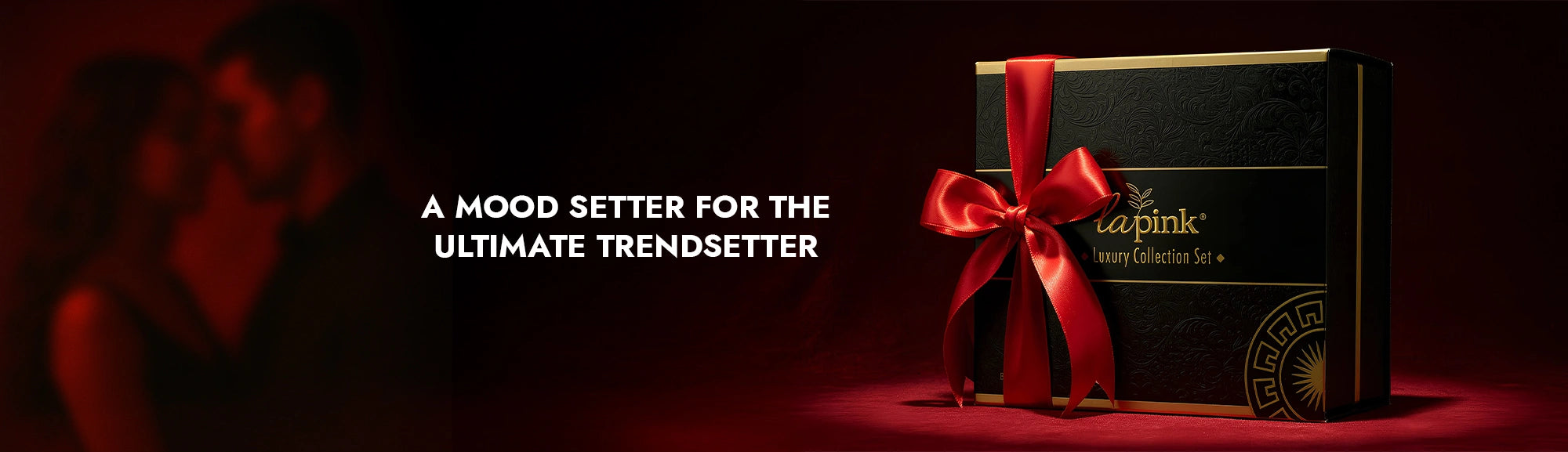 Gift box with red ribbon on a dark background with text about a mood setter for the ultimate trendsetter.