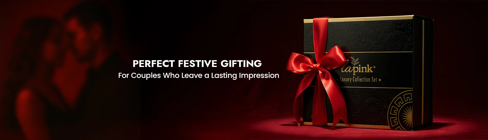 Gift box with a red ribbon on a dark background, featuring the brand 'caprice pink'.