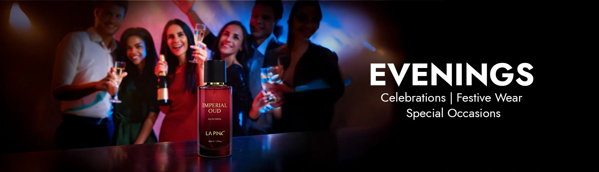 People celebrating with drinks in a dimly lit room, featuring a bottle labeled 'La Rime'.