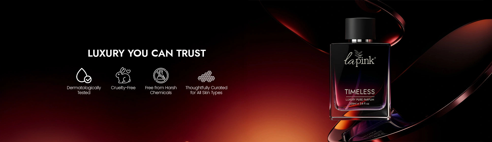 La Pink Timeless perfume bottle on a dark background with brand promises displayed.