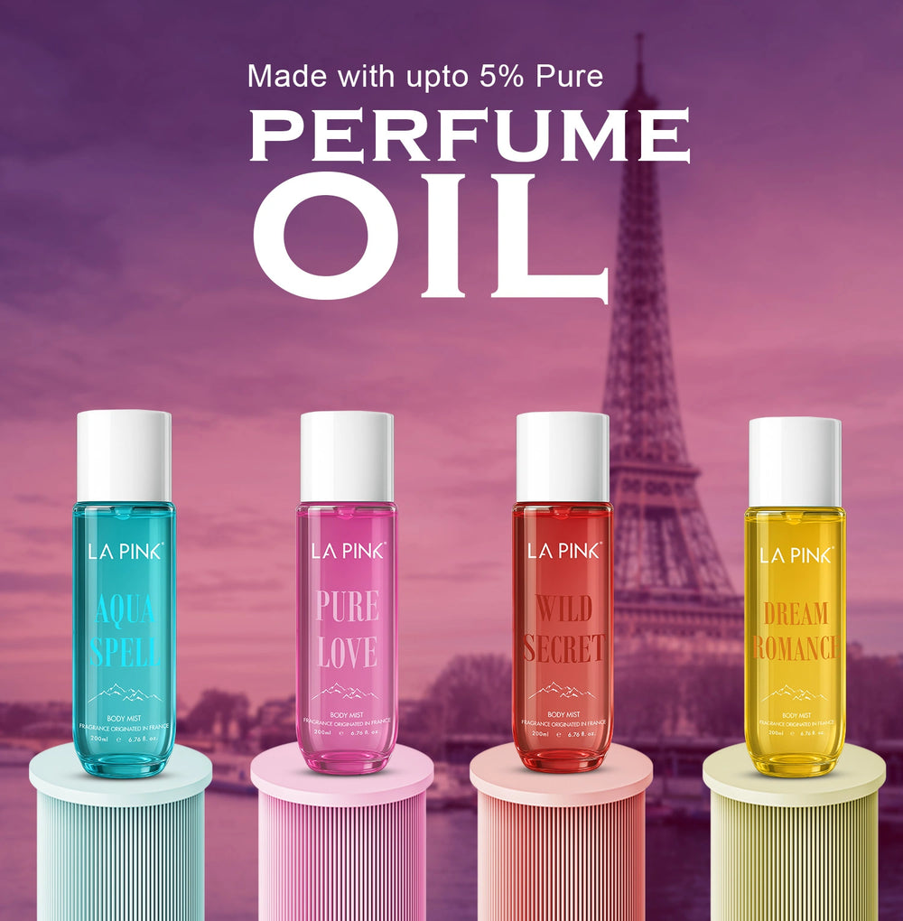 Four bottles of La Pink perfume oil with the Eiffel Tower in the background