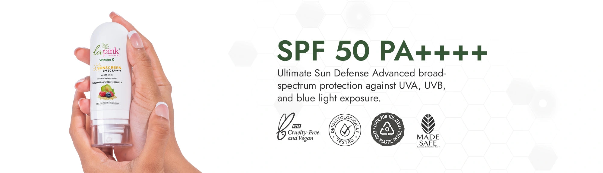 Hand holding a sunscreen bottle with SPF 50 PA+++++ text and product details on a white background