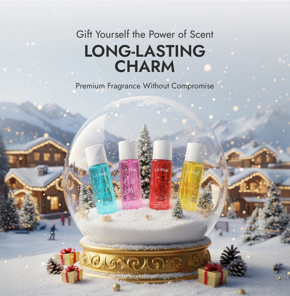 Snow globe with four small bottles of perfume against a snowy village background