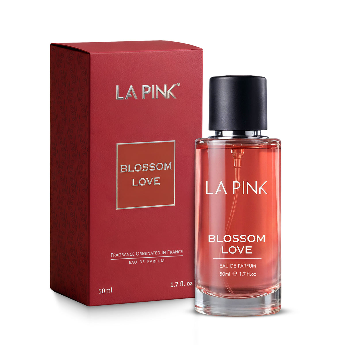La Pink Blossom Love Eau de Parfum bottle with a black cap next to its textured red packaging box, on a white background.

