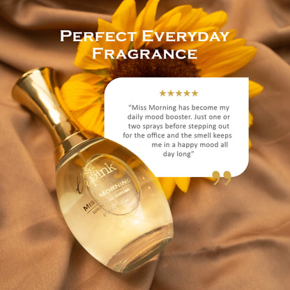 Perfume bottle with sunflower on a brown fabric background, labeled &