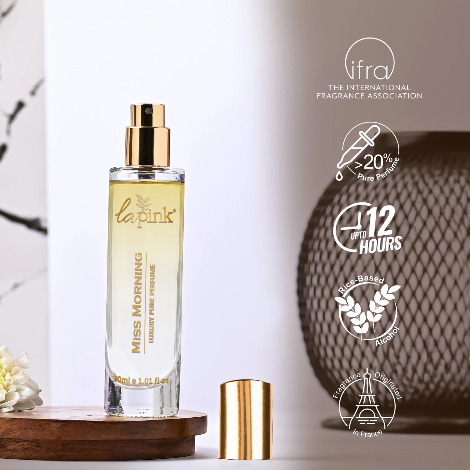 La Pink perfume bottle with gold cap on a white background, featuring IFRA logo and product details.