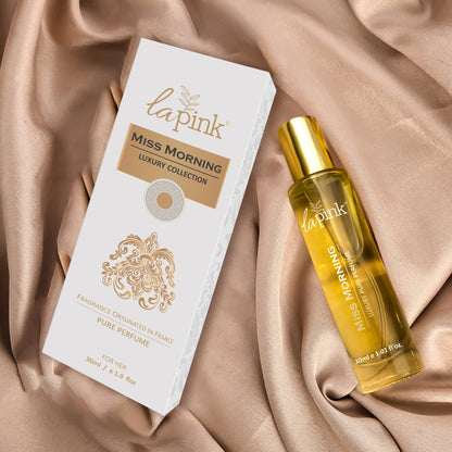 La Pink Miss Morning luxury collection perfume bottle and packaging on a beige fabric background