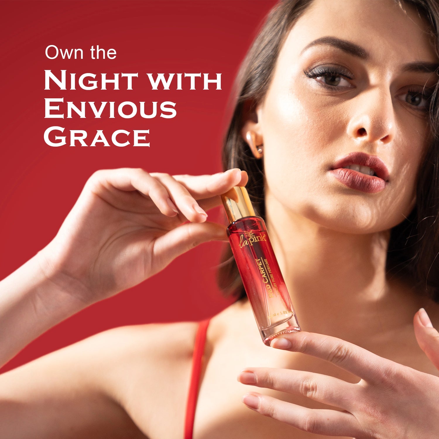 Woman holding a perfume bottle with text &