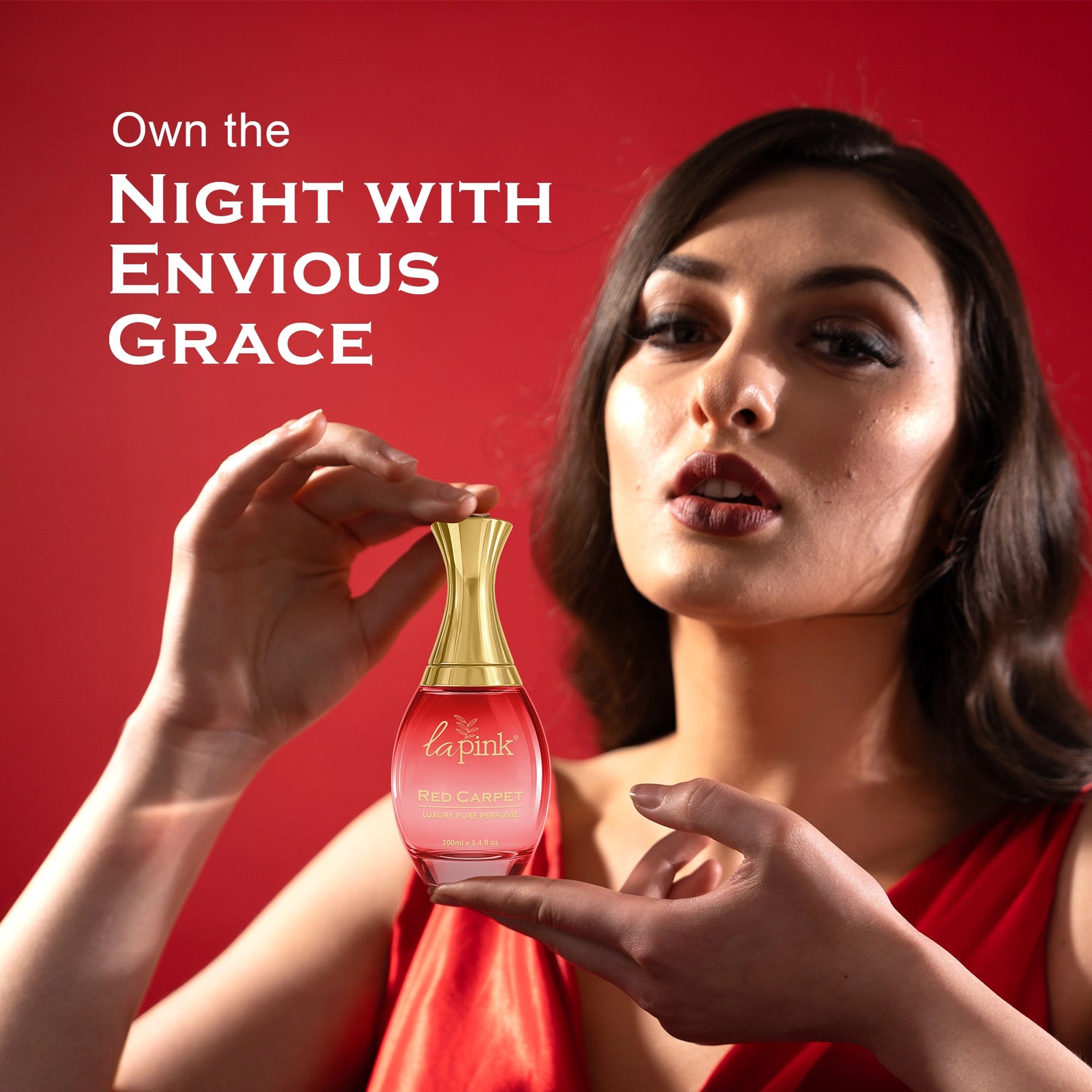Woman holding a perfume bottle with text &