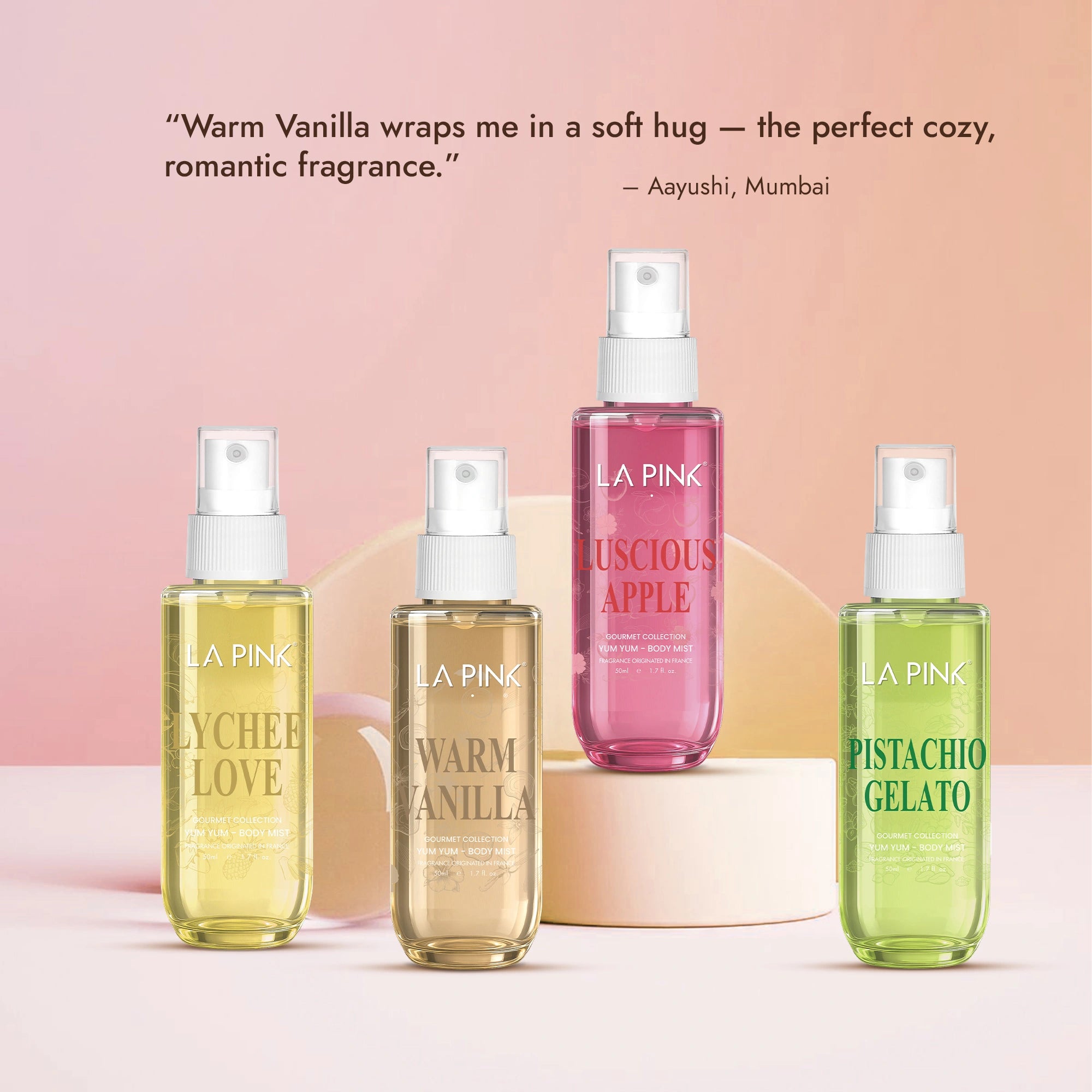 Four bottles of LA Pink fragrances on a pink background with a quote from Aayushi, Mumbai.