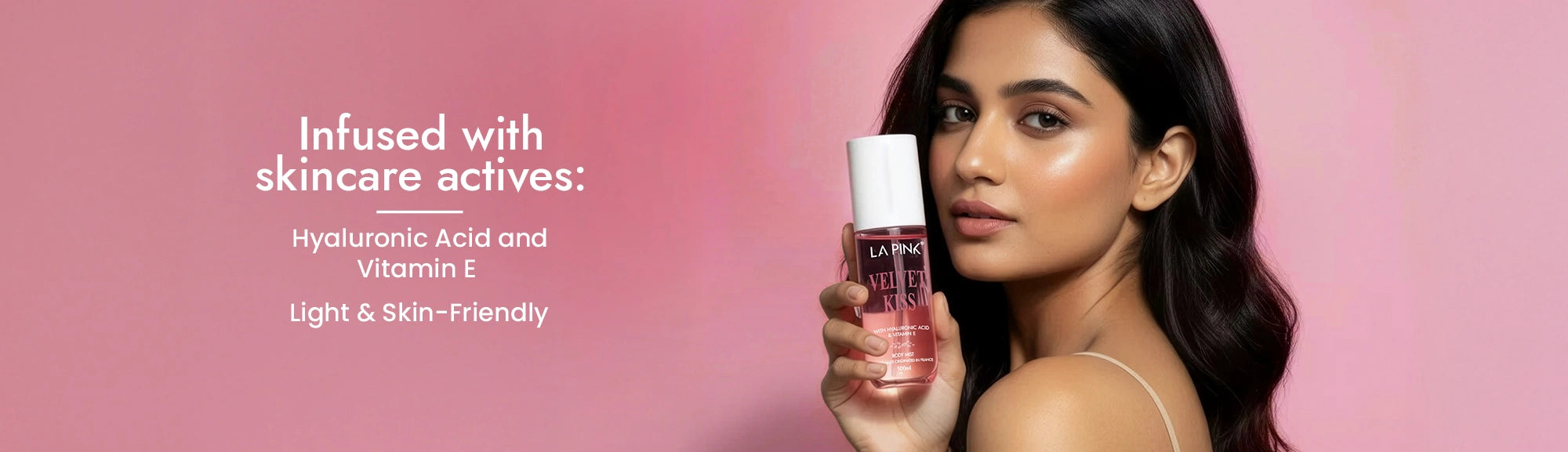 Woman holding a skincare product with text about skincare actives on a pink background