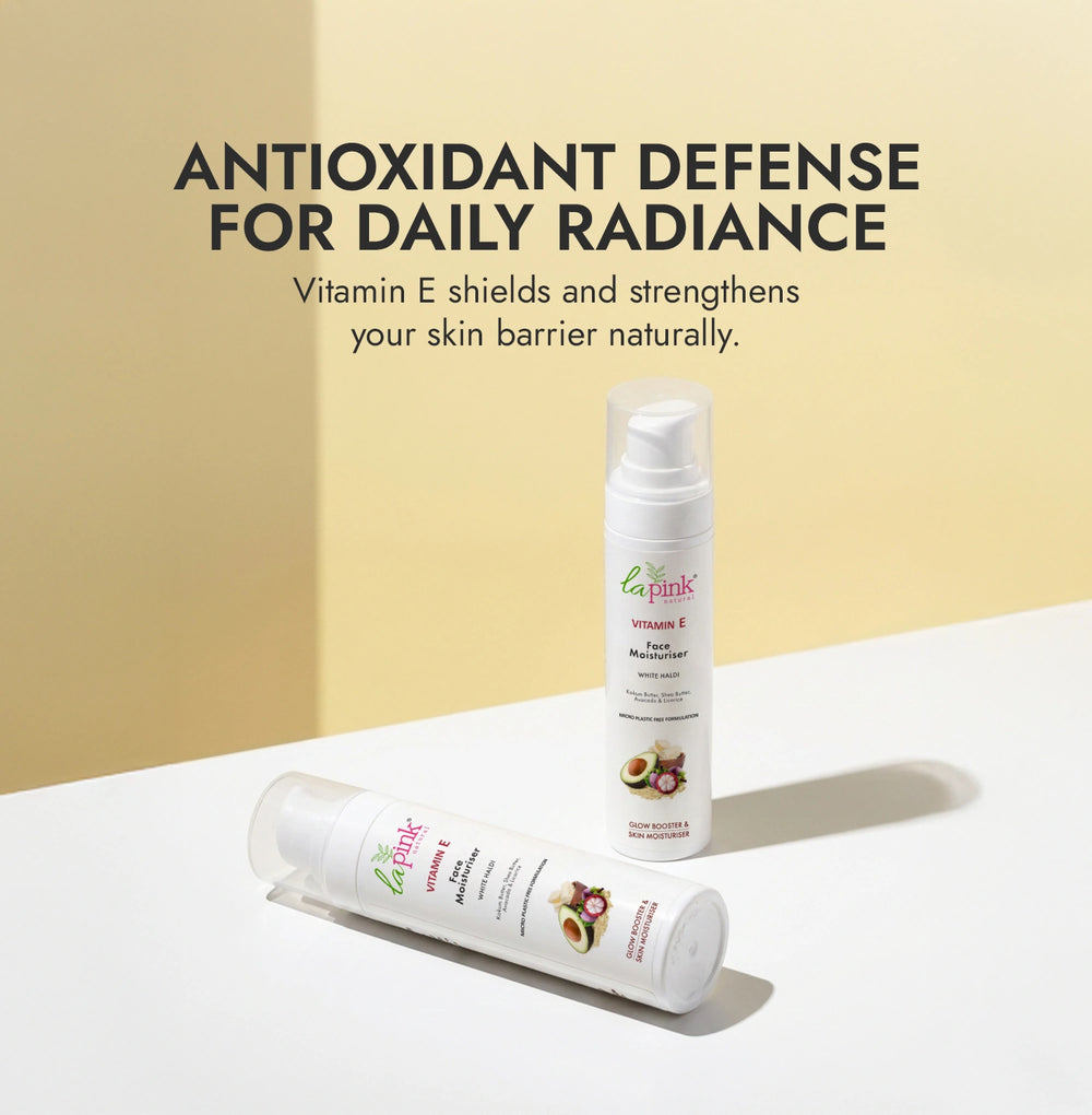 Two bottles of La Roche-Posay Vitamin E cream on a white surface with a beige background.