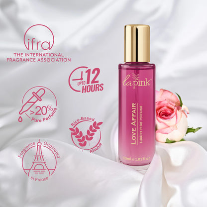La Pink Love Affair perfume bottle with brand logos on a soft white background