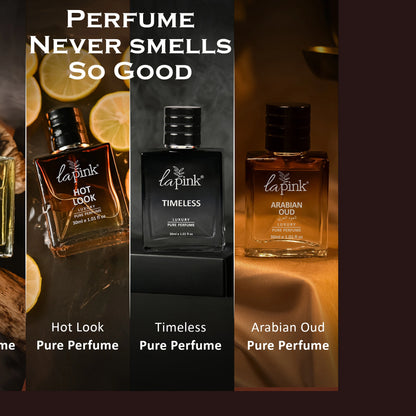 Three La Pink perfume bottles with different scents on a dark background.